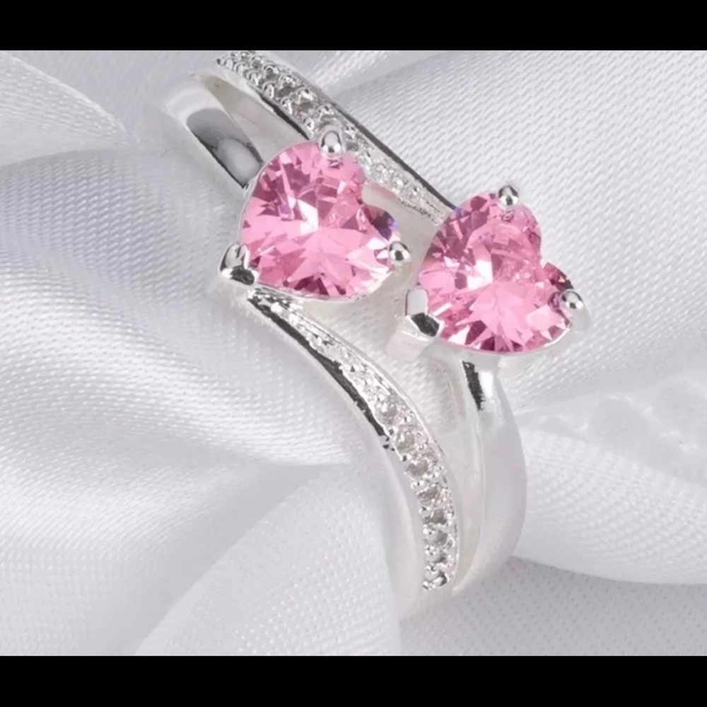 Pink sapphire and tiny diamonds ring.